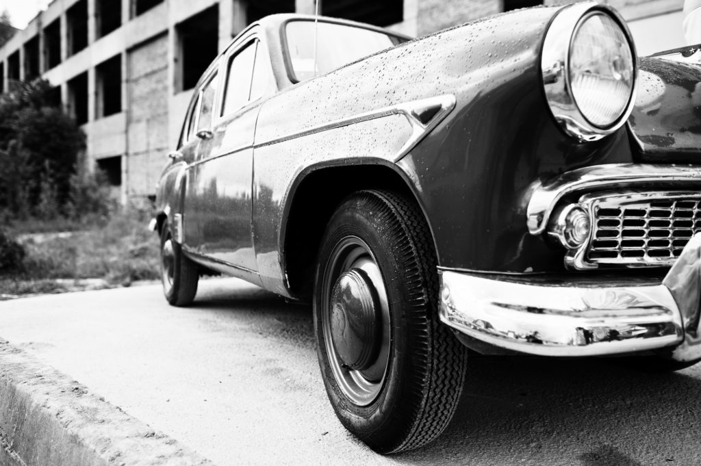 Side of the old vintage retro car. Black and white photo